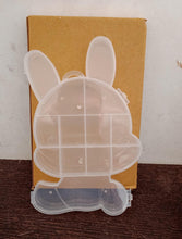 Clear plastic storage box with cartoon bear design.